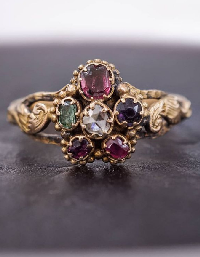 Early Victorian acrostic ring in pansy form, circa 1830. The gems spell out REGARD, a message of love. From Nalfie's.