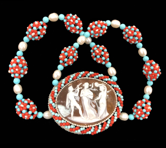 A beautiful custom necklace by Carada - a vintage cameo surrounded by coral, pearl, and turquoise beadwork. 