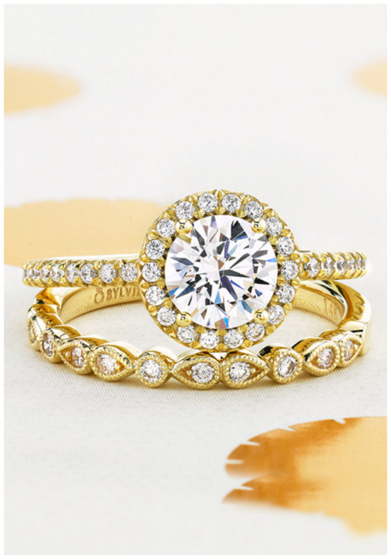 A yellow gold wedding set by Sylvie Collection. I love this wedding band with this engagement ring! A classic round brilliant diamond with a halo.