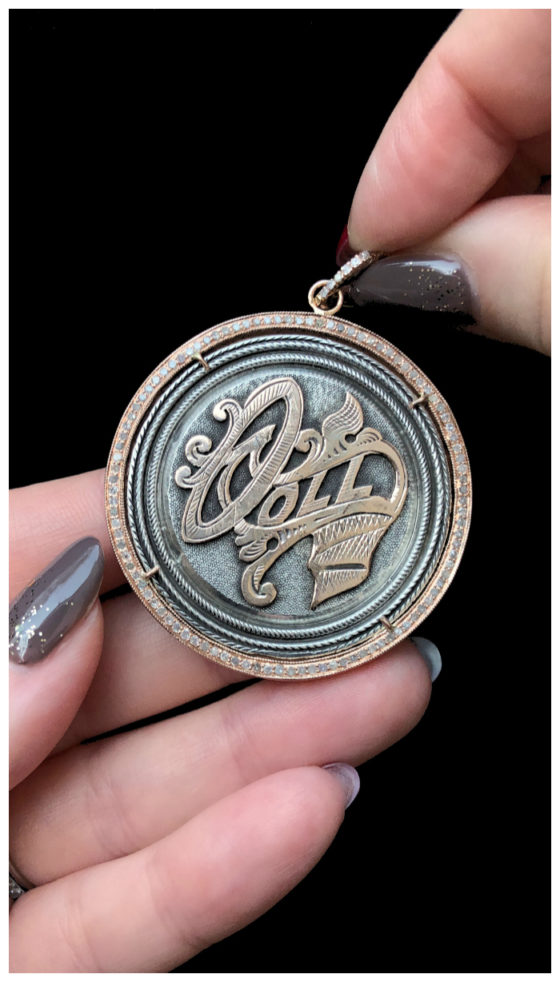 An extraordinary Victorian era love pendant token by Heavenly Vices! This one says 'Doll,' with rose gold accents.