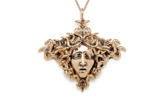 The magnificent Medusa pendant necklace by Sofia Zakia. Handmade in 14K yellow gold with a ruby.