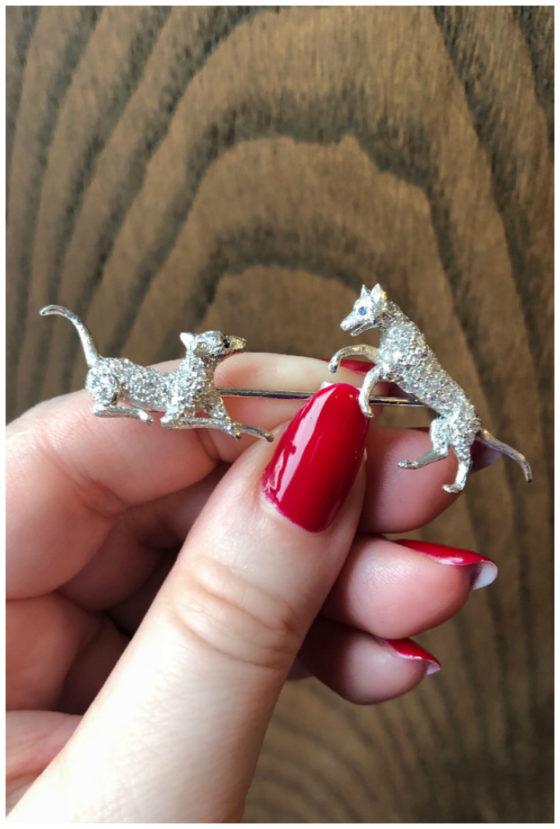 A beautiful antique diamond brooch or jabot pin from Wilson's Estate Jewelry! Either dogs or wolves. .