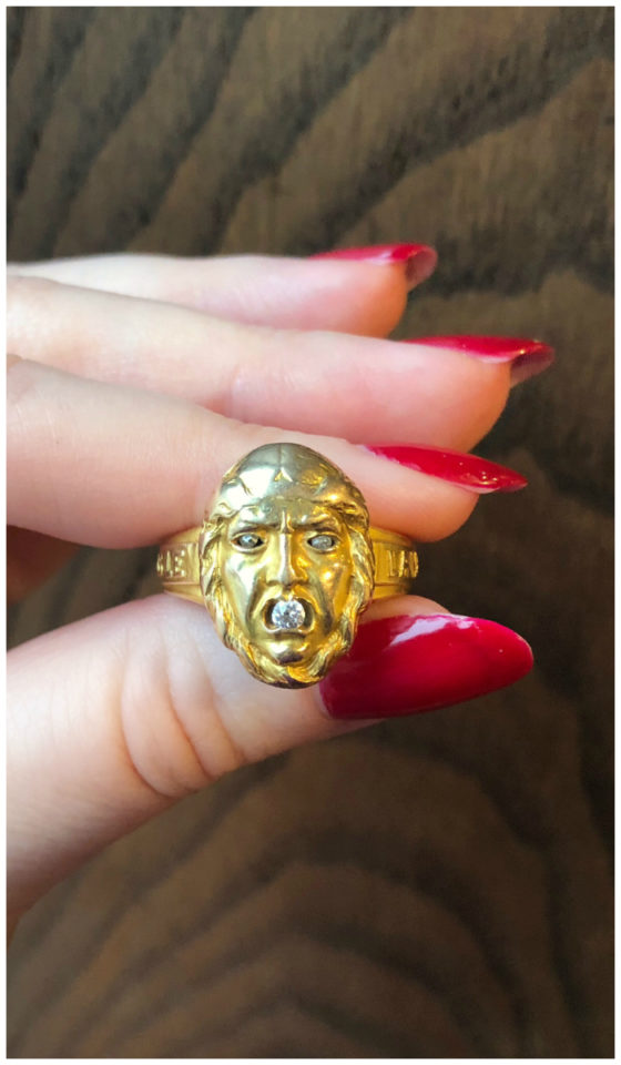 An incredible antique gold ring from Wilson's Estate Jewelry! This ring is a locket; the face flips up to reveal a picture.