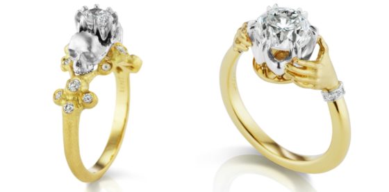 Two beautiful, haunting engagement rings by Anthony Lent. One with hands and one with skulls, both in yellow gold with diamonds.