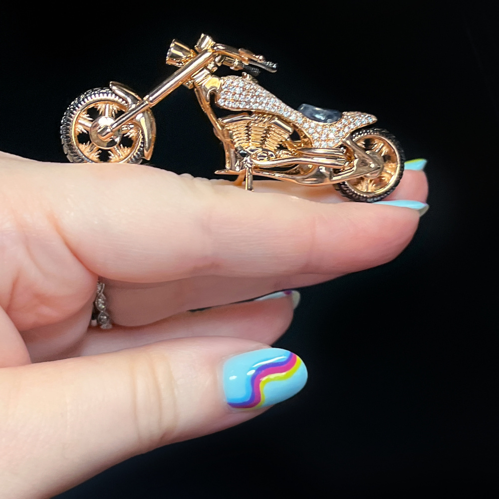 18K rose gold Harley Davidson motorcycle handmade by Rodney Rahmani of Brilliant Stars. With sapphires and diamonds.