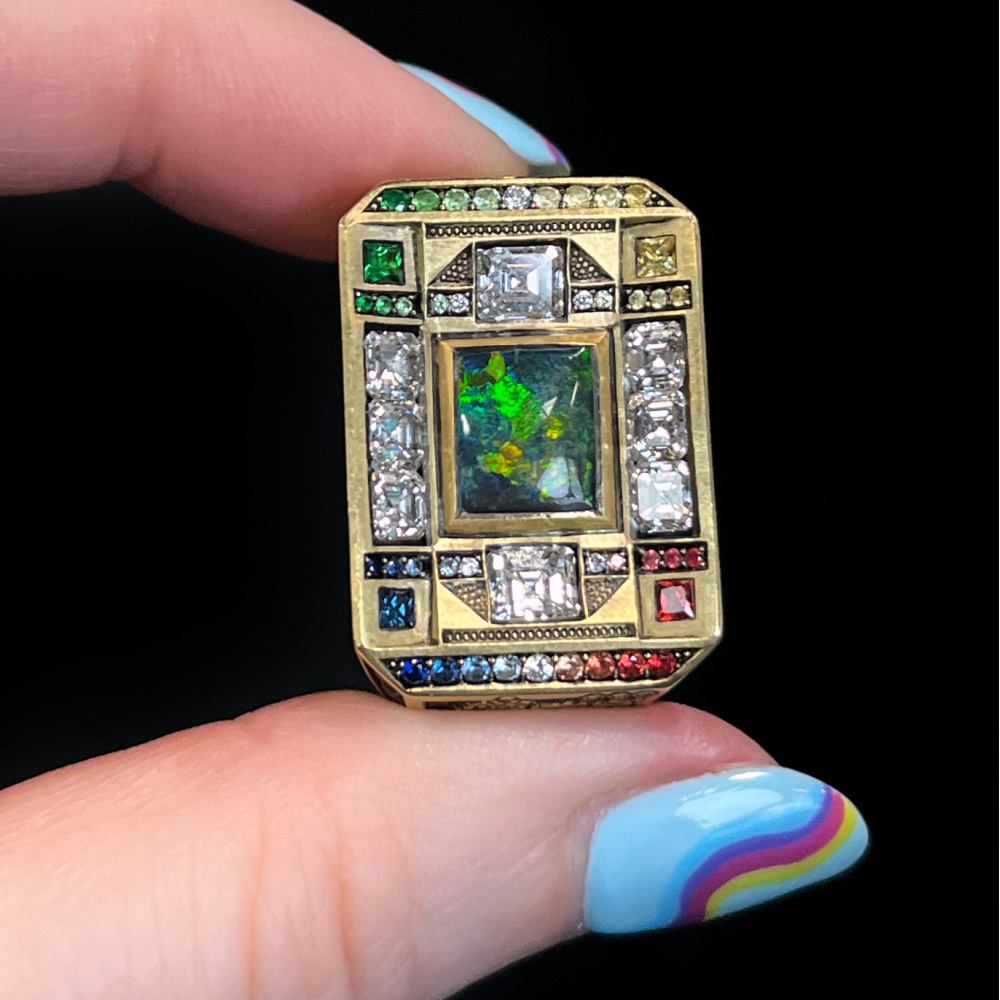 Gold and platinum 'Underworld' ring by Third Eye Assembly, with a 1.62 ct. black Opal, tsavorite Garnet, sapphire and diamond.