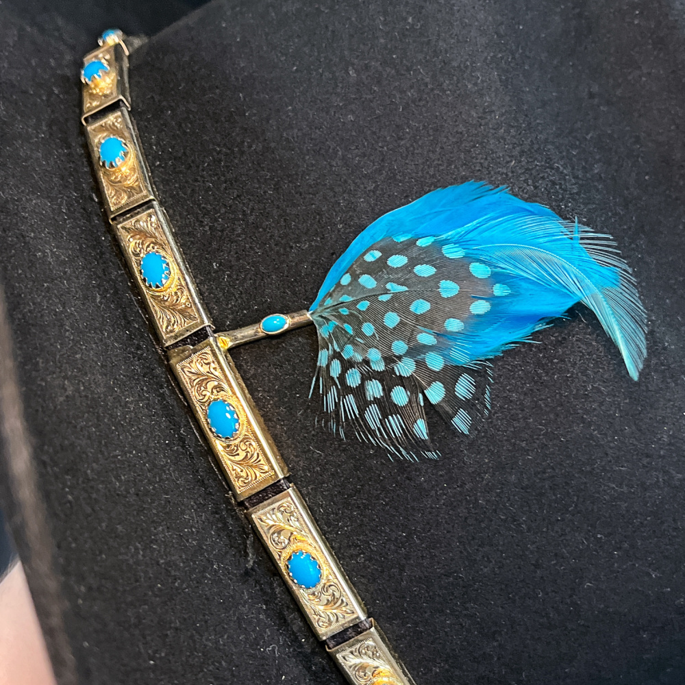 Men's cowboy hat with 14K yellow gold and turquoise hat band, by Eric E. Wright of Village Goldsmith and Antiques; close up view.